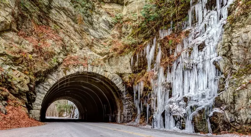 frozen waterfall next to tunnel