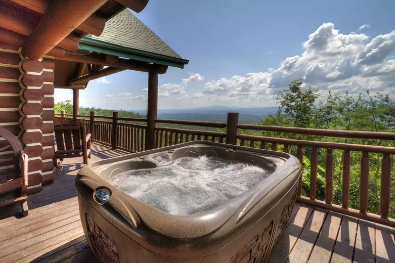 hot tub on porch with mountain views